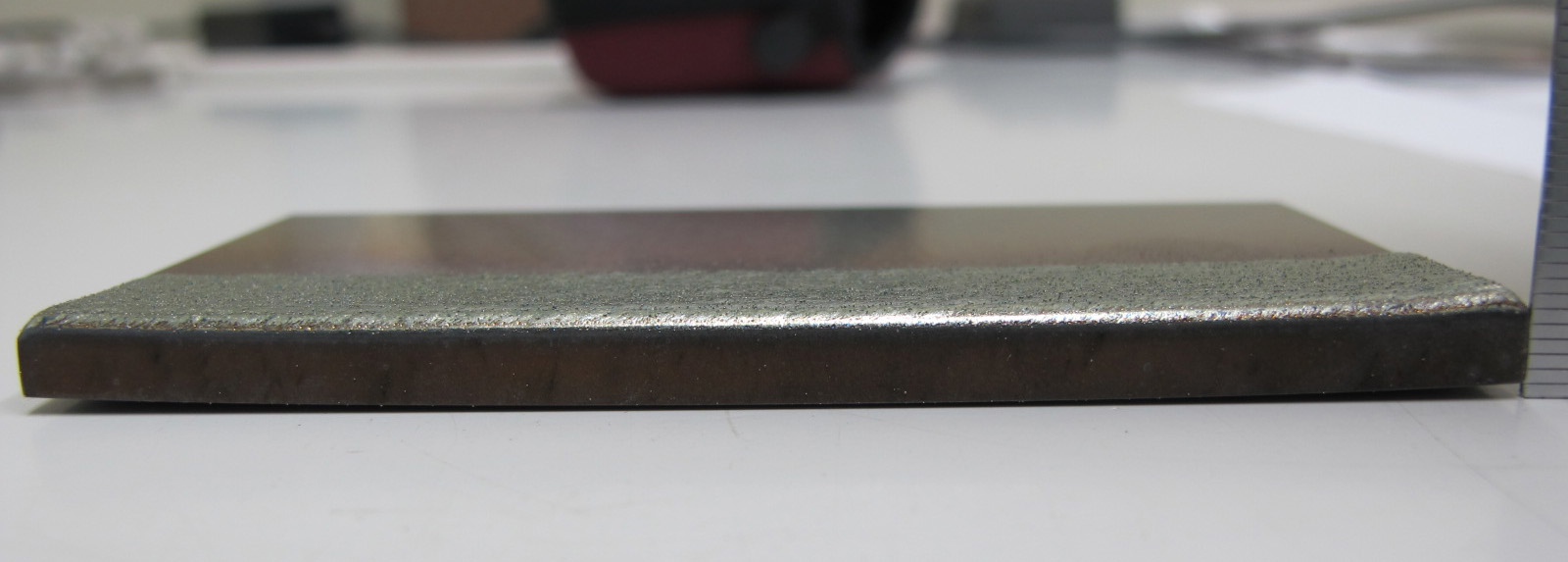 皮膜施工後の基材(50×100×5mmt)歪状況